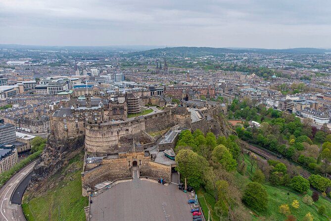 Edinburgh Castle: Guided Walking Tour with Entry Ticket - The uphill walk and Esplanade stops: sieges, viewpoints, and the Tattoo connection