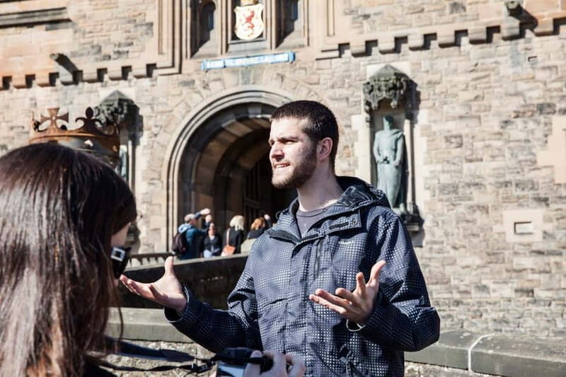 Edinburgh: Edinburgh Castle Guided History Tour with Tickets - Starting on the Royal Mile: find Adam Smith and the green umbrellas