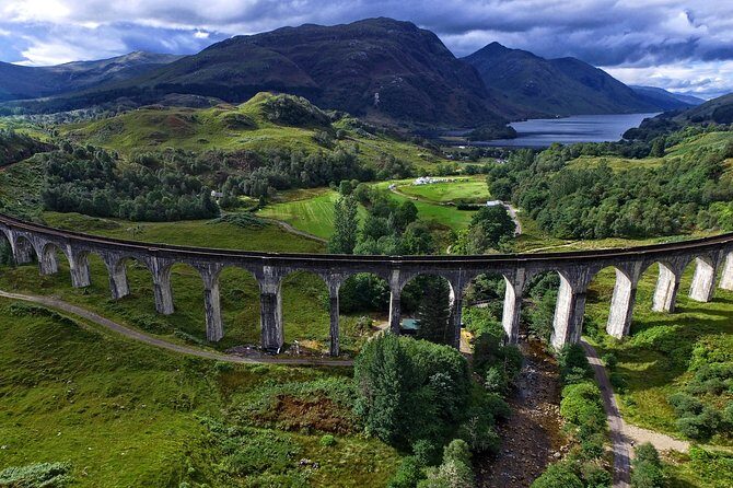 The Magical Highland Tour Including the Jacobite Steam Train Journey - Glenfinnan Visitor Centre: photographing the steam train on the viaduct